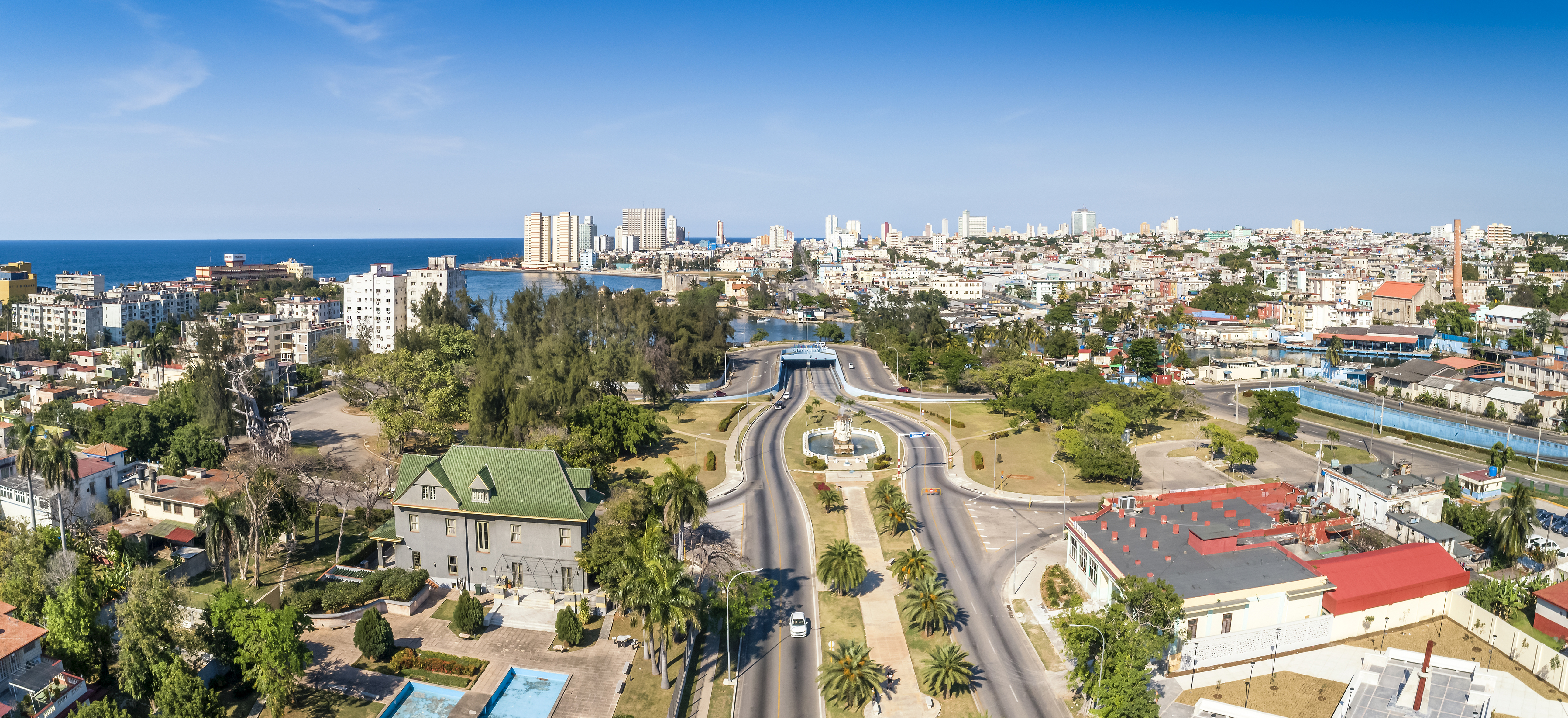a city with a body of water and a fountain