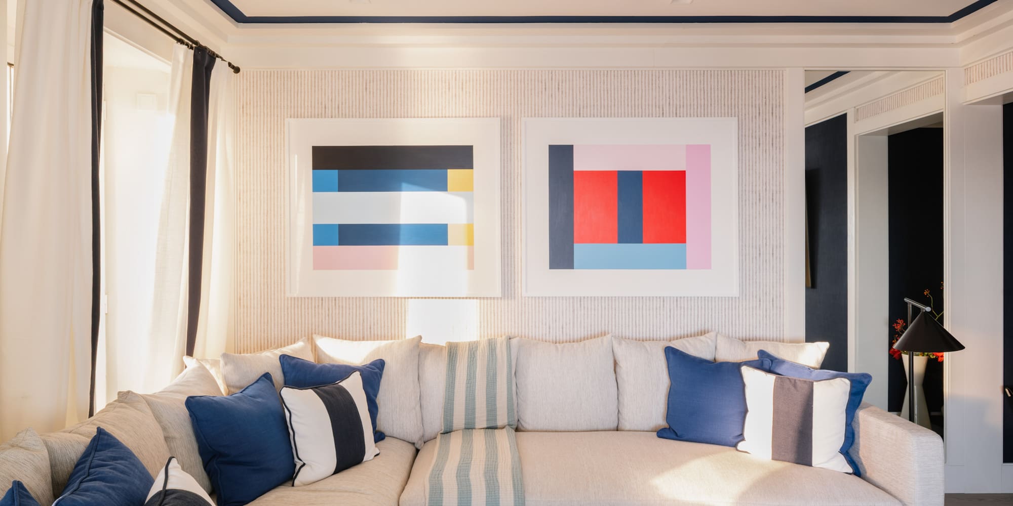 a couch with pillows and a coffee table in a room