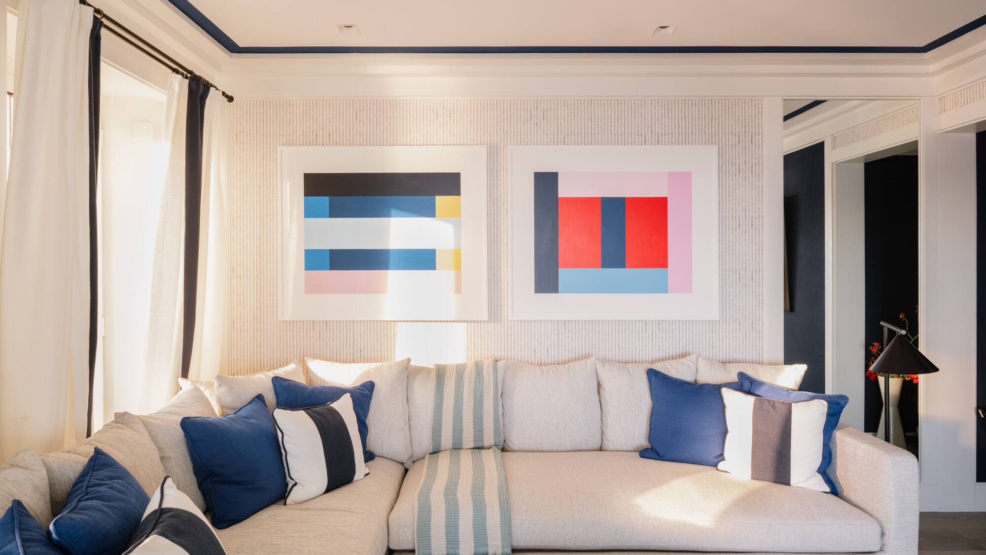 a couch with pillows and a coffee table in a room