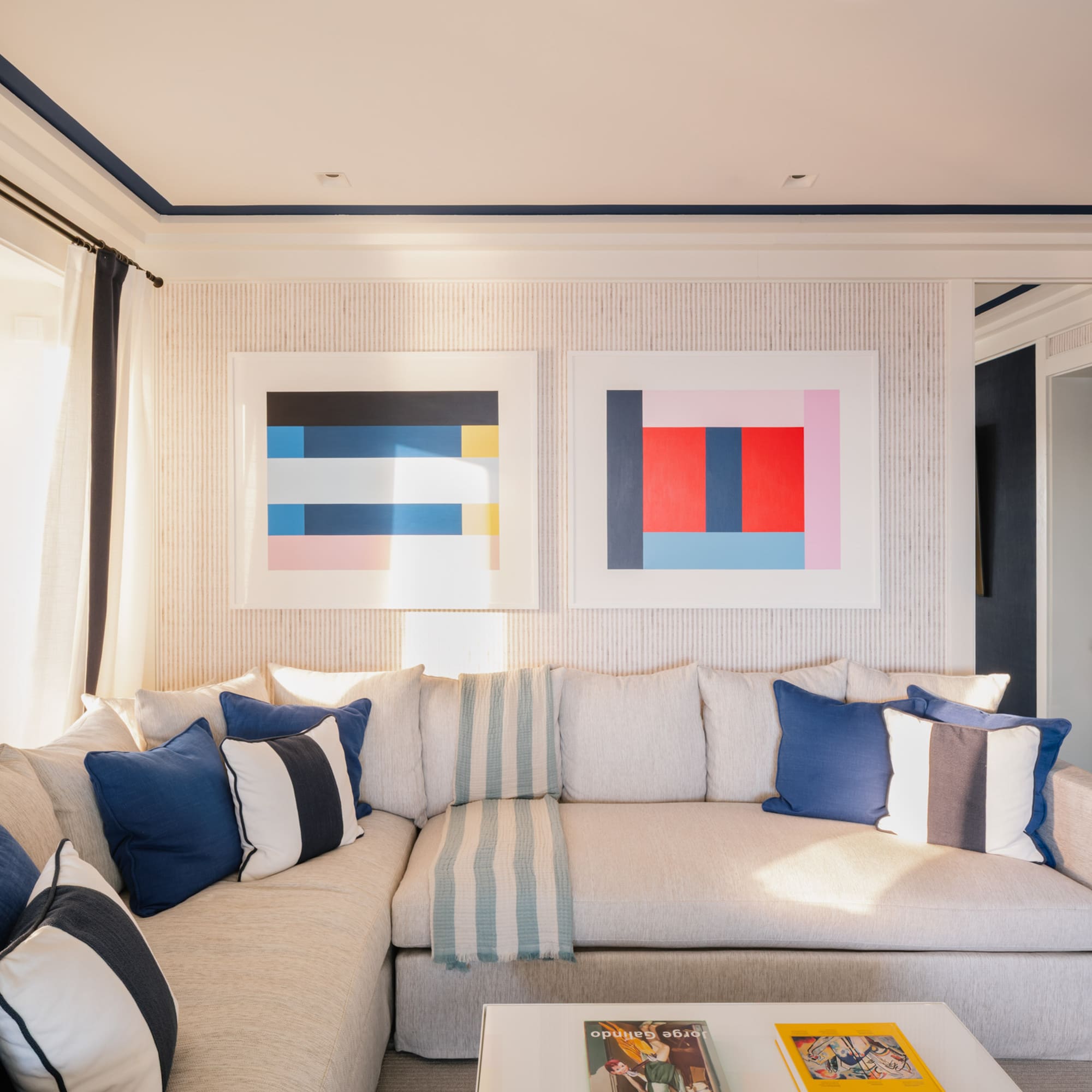 a couch with pillows and a coffee table in a room