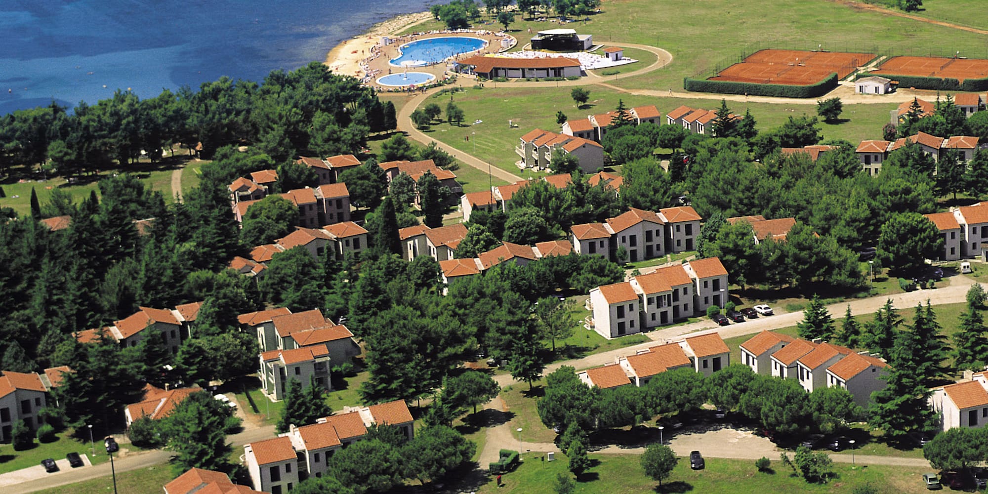 a aerial view of a town by the water