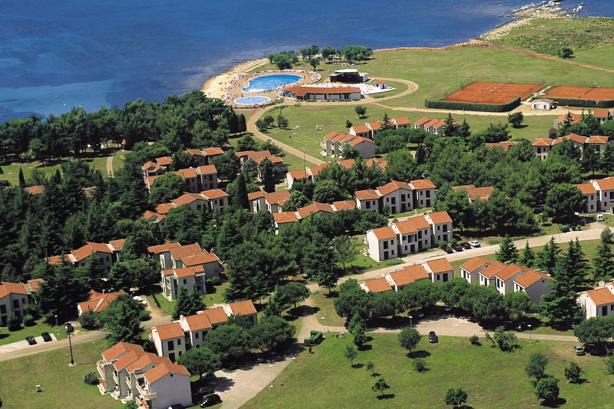 a aerial view of a town by the water
