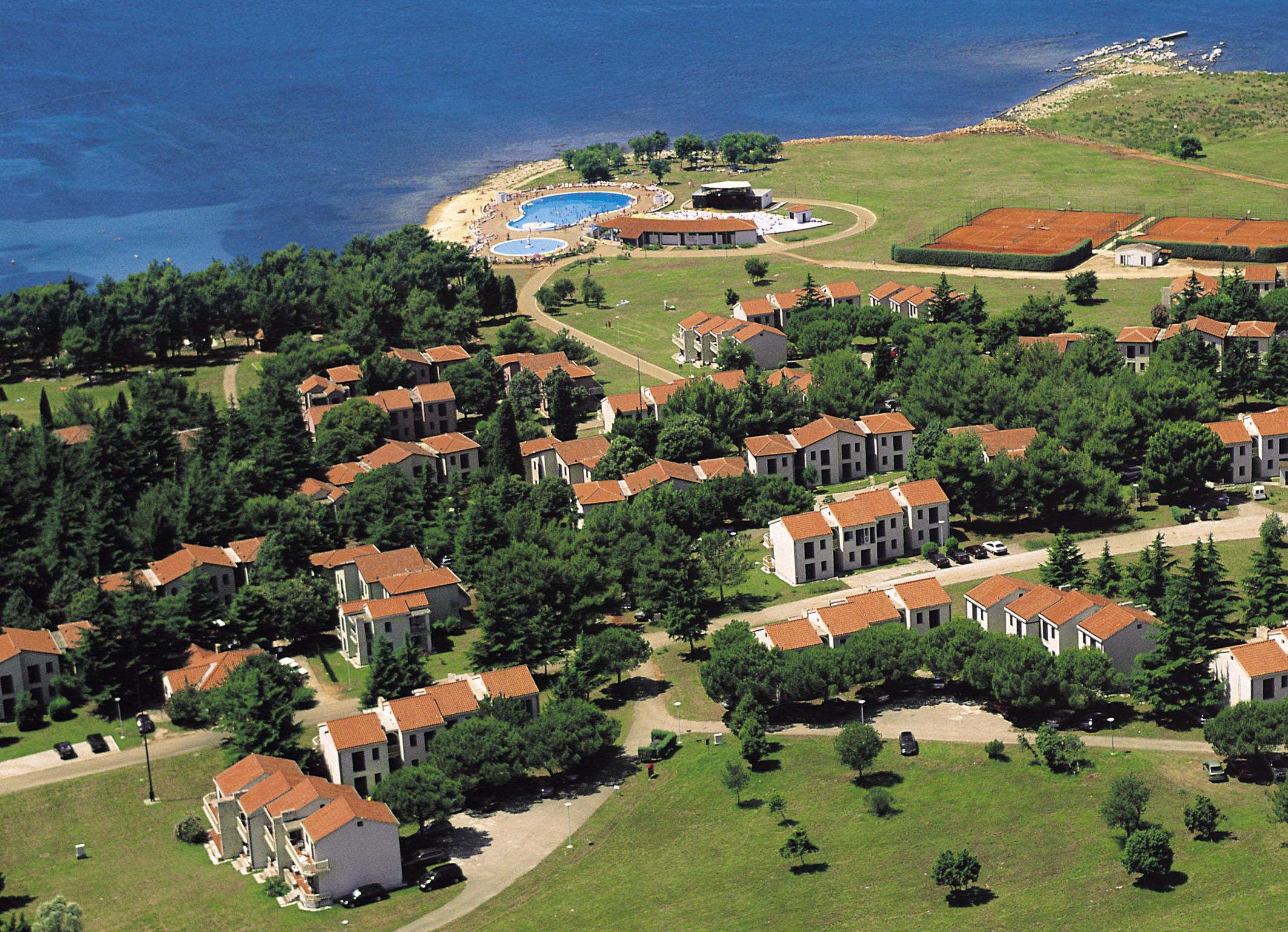 a aerial view of a town by the water