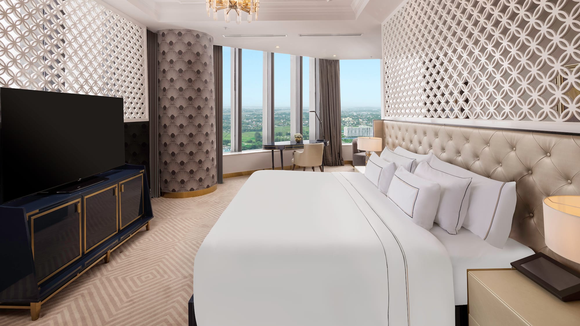 a room with a large bed and a television