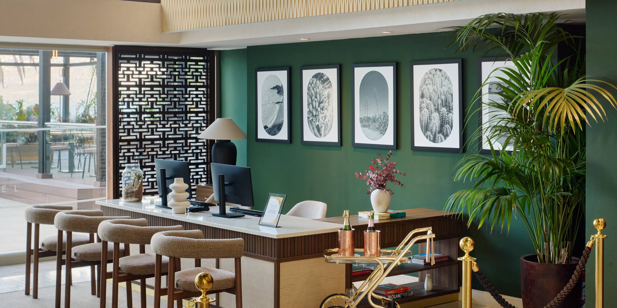 a room with a computer desk and chairs