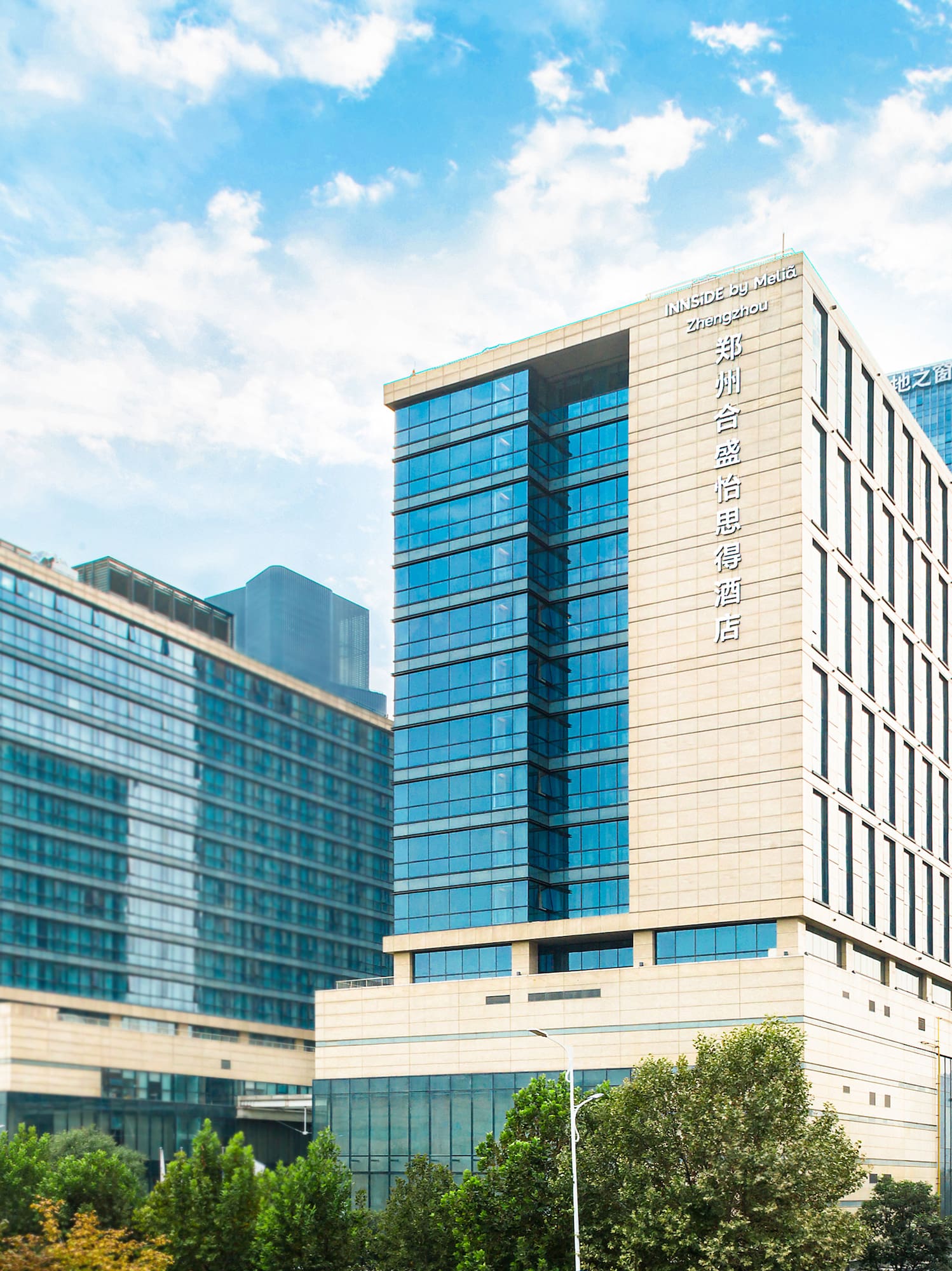 a group of tall buildings with trees