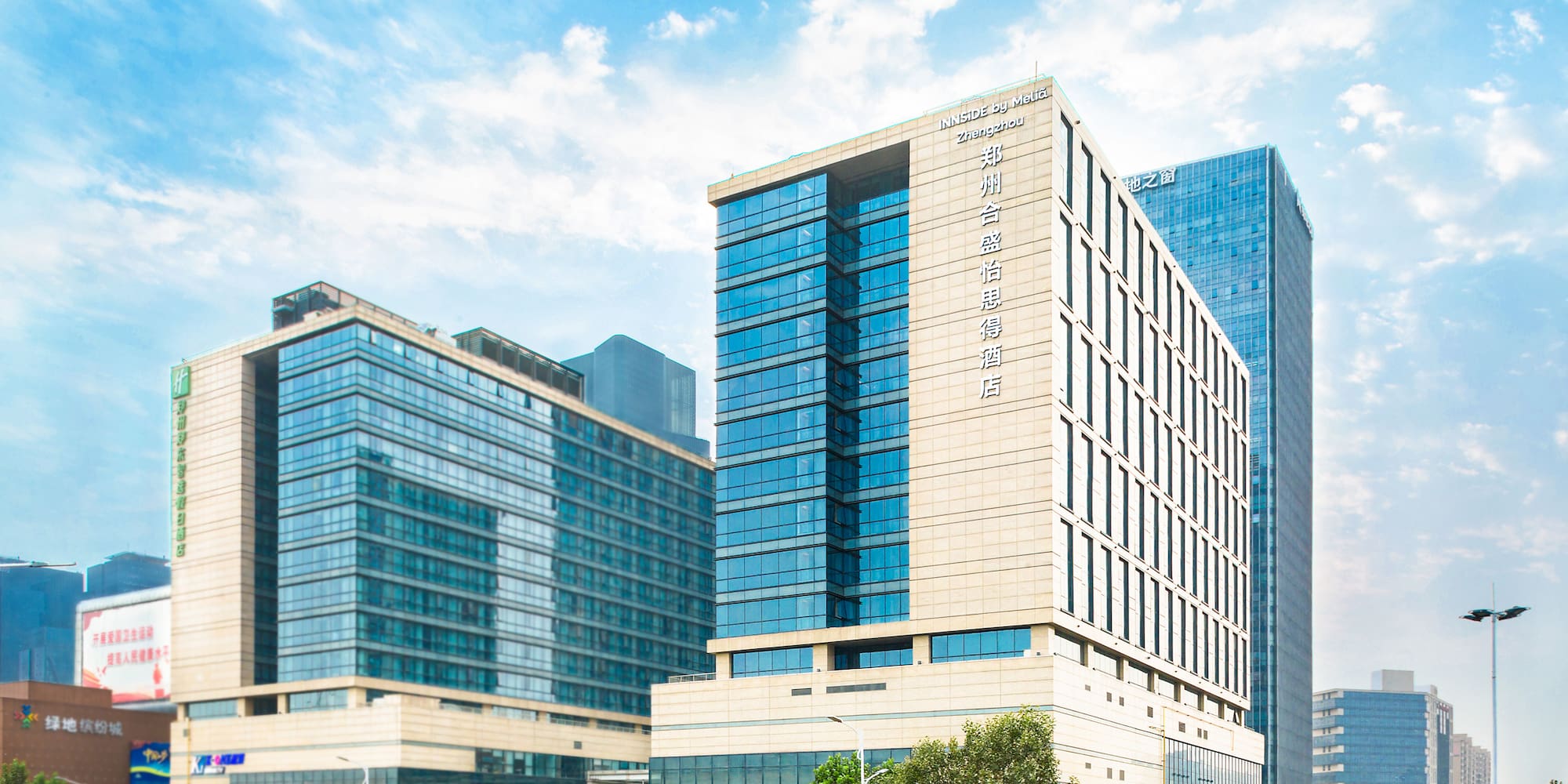a group of tall buildings with trees