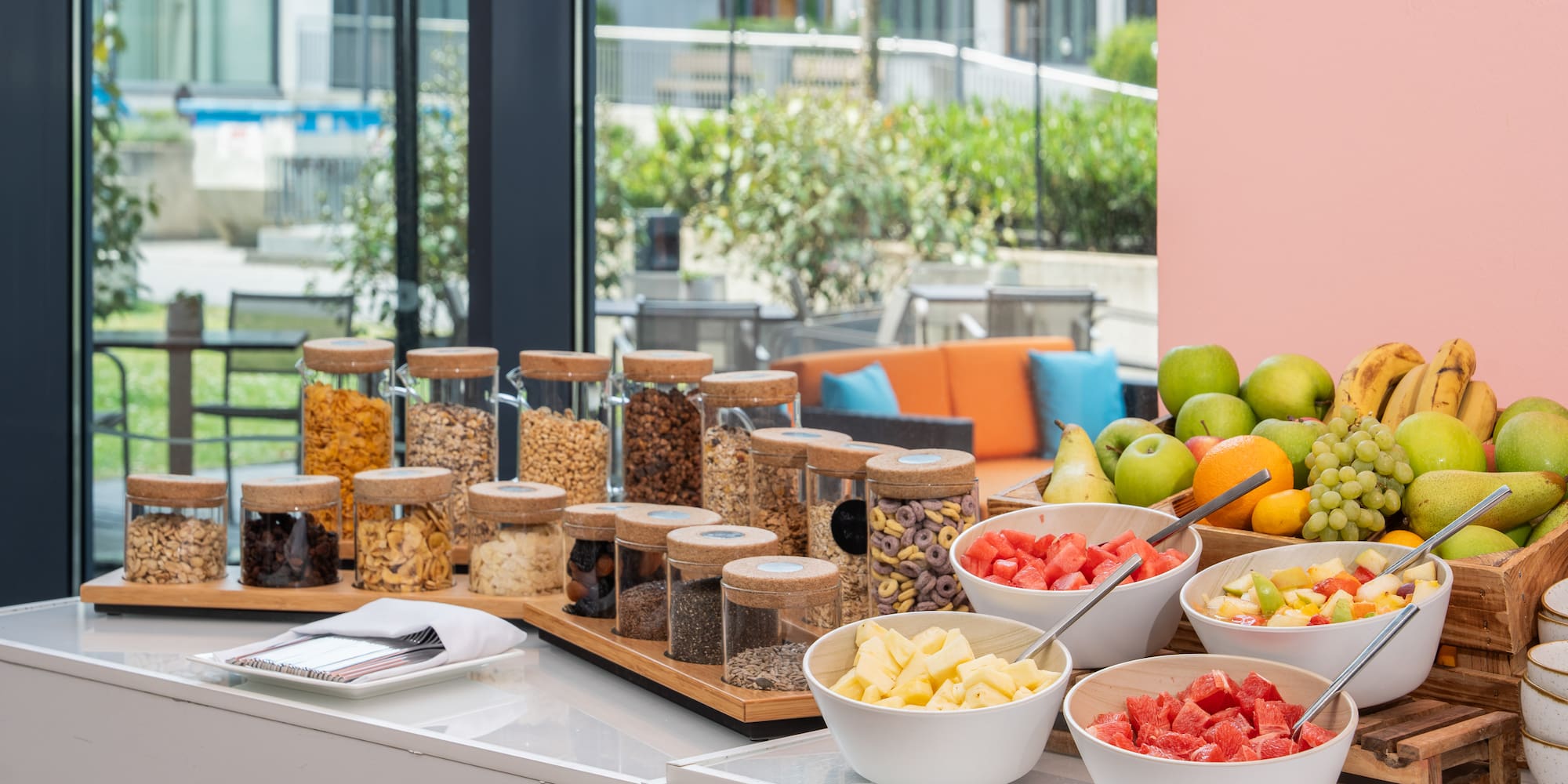 a table with bowls of food and fruits