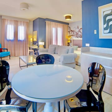 a room with a table and chairs