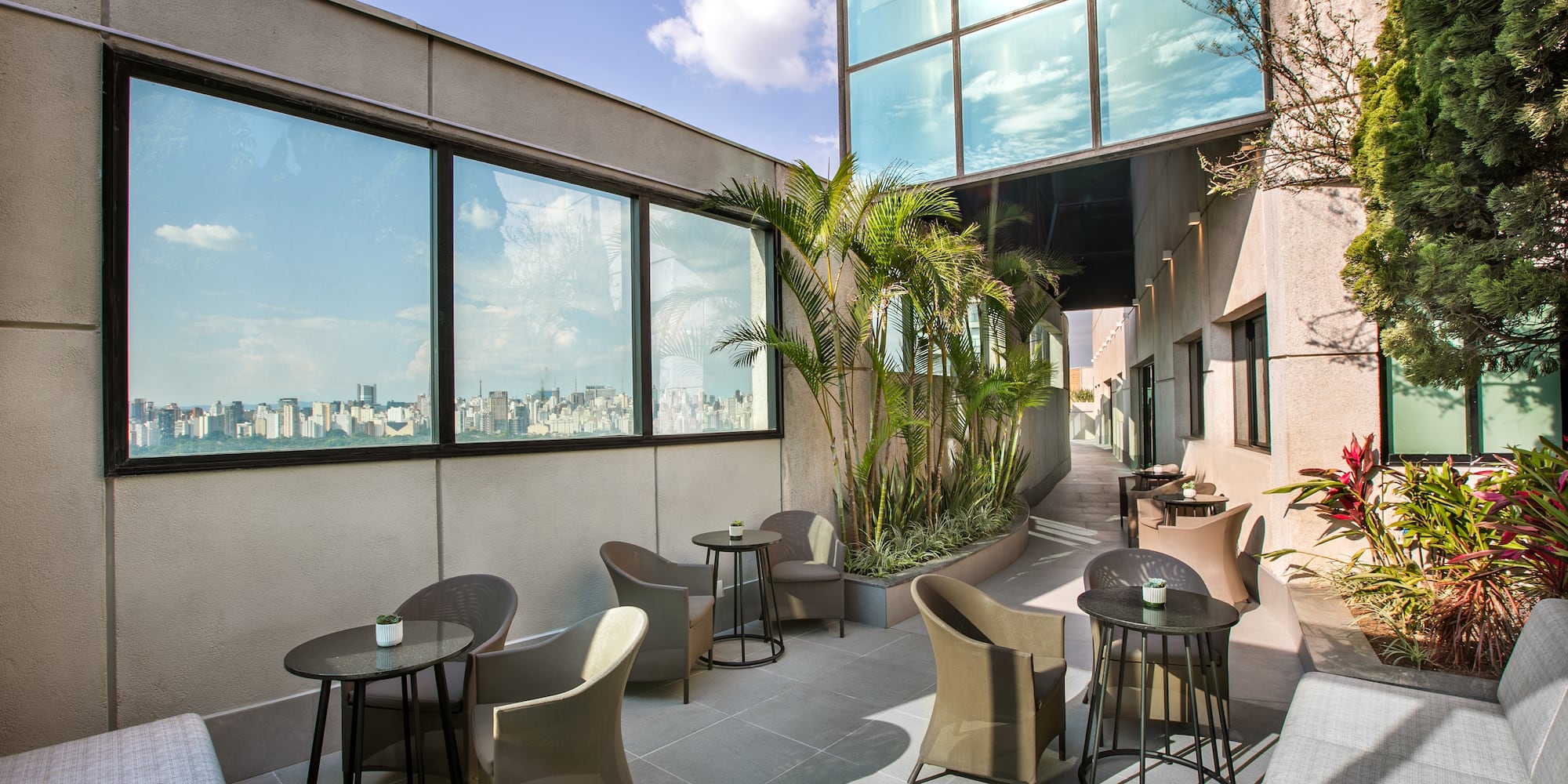 a patio with chairs and tables
