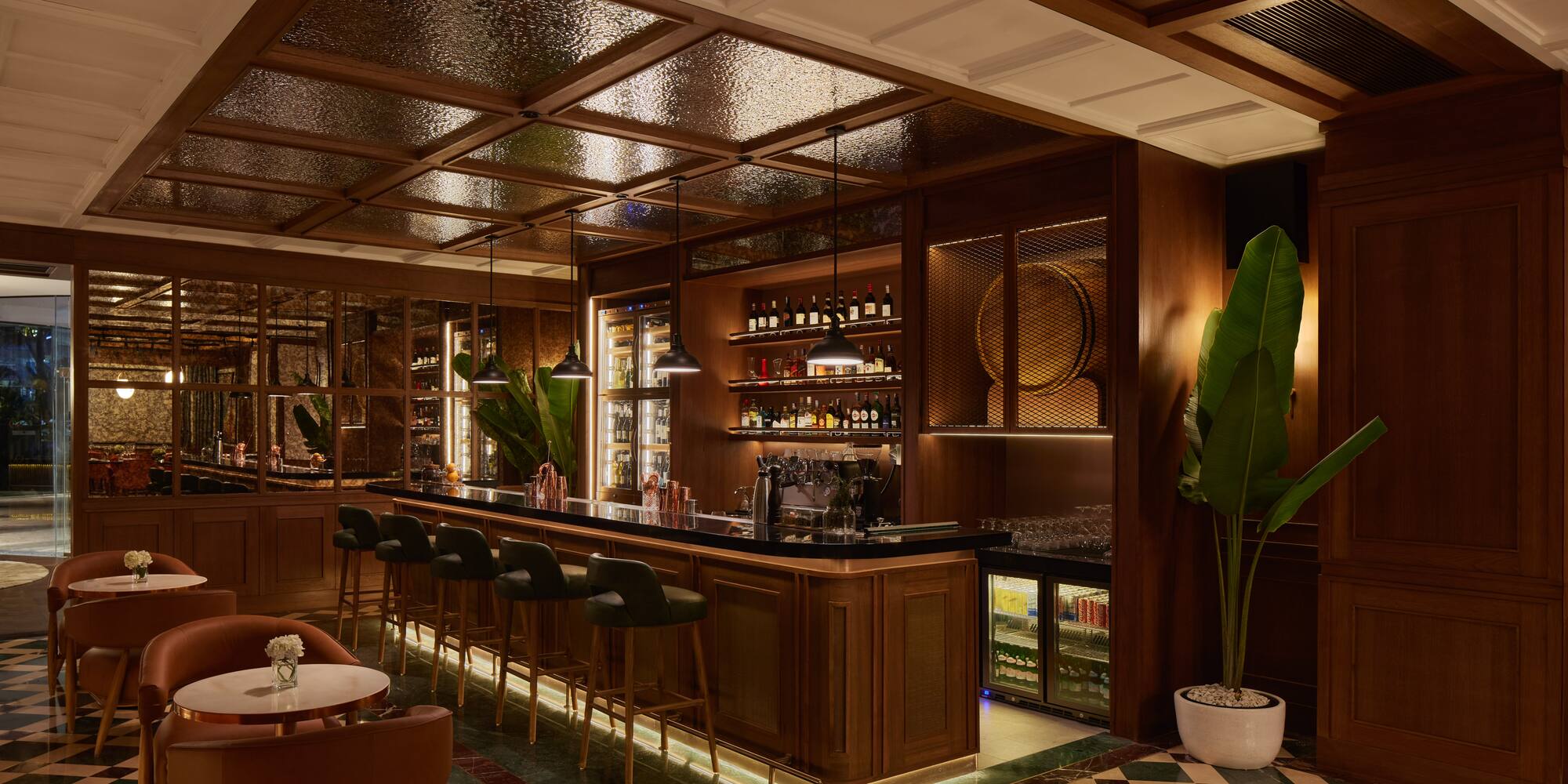 a bar with a bar stools and chairs