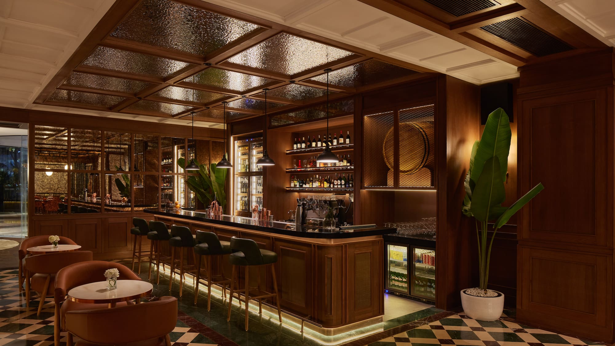 a bar with a bar stools and chairs