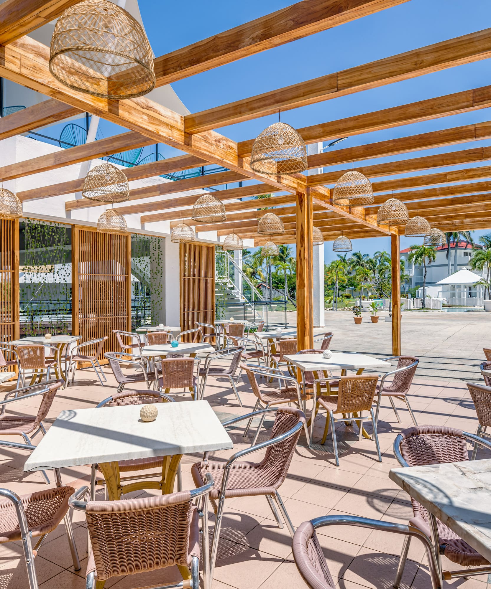 a patio with tables and chairs