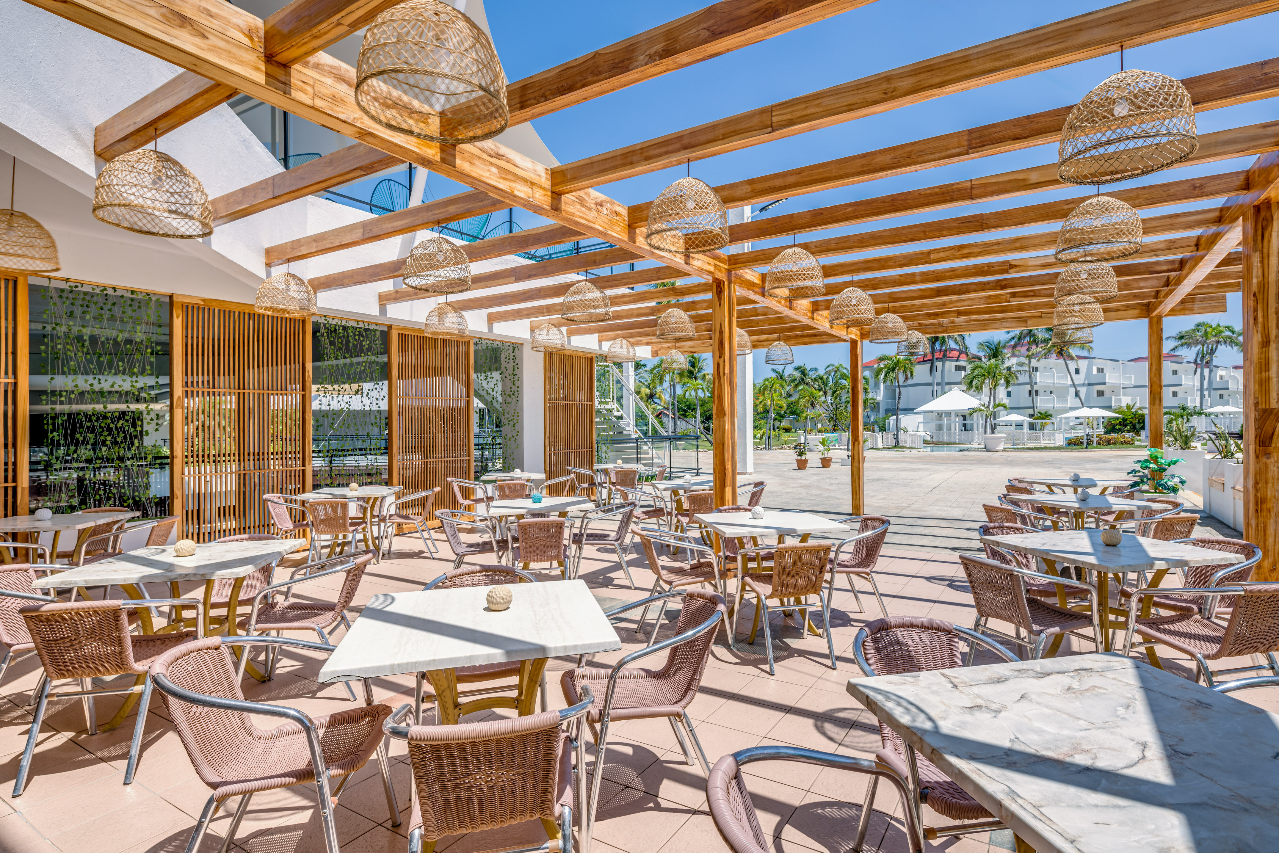 a patio with tables and chairs