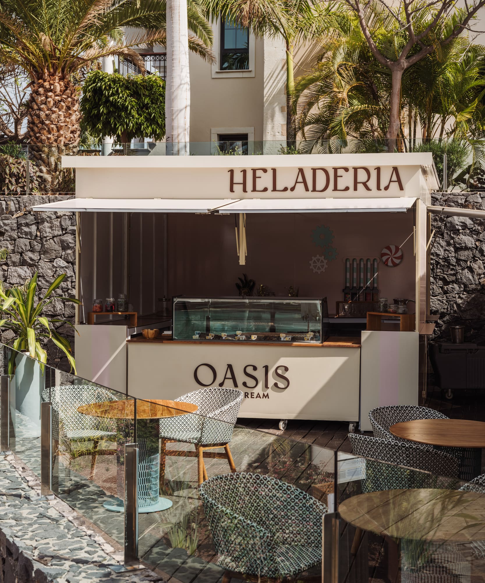 a food stand outside with tables and chairs