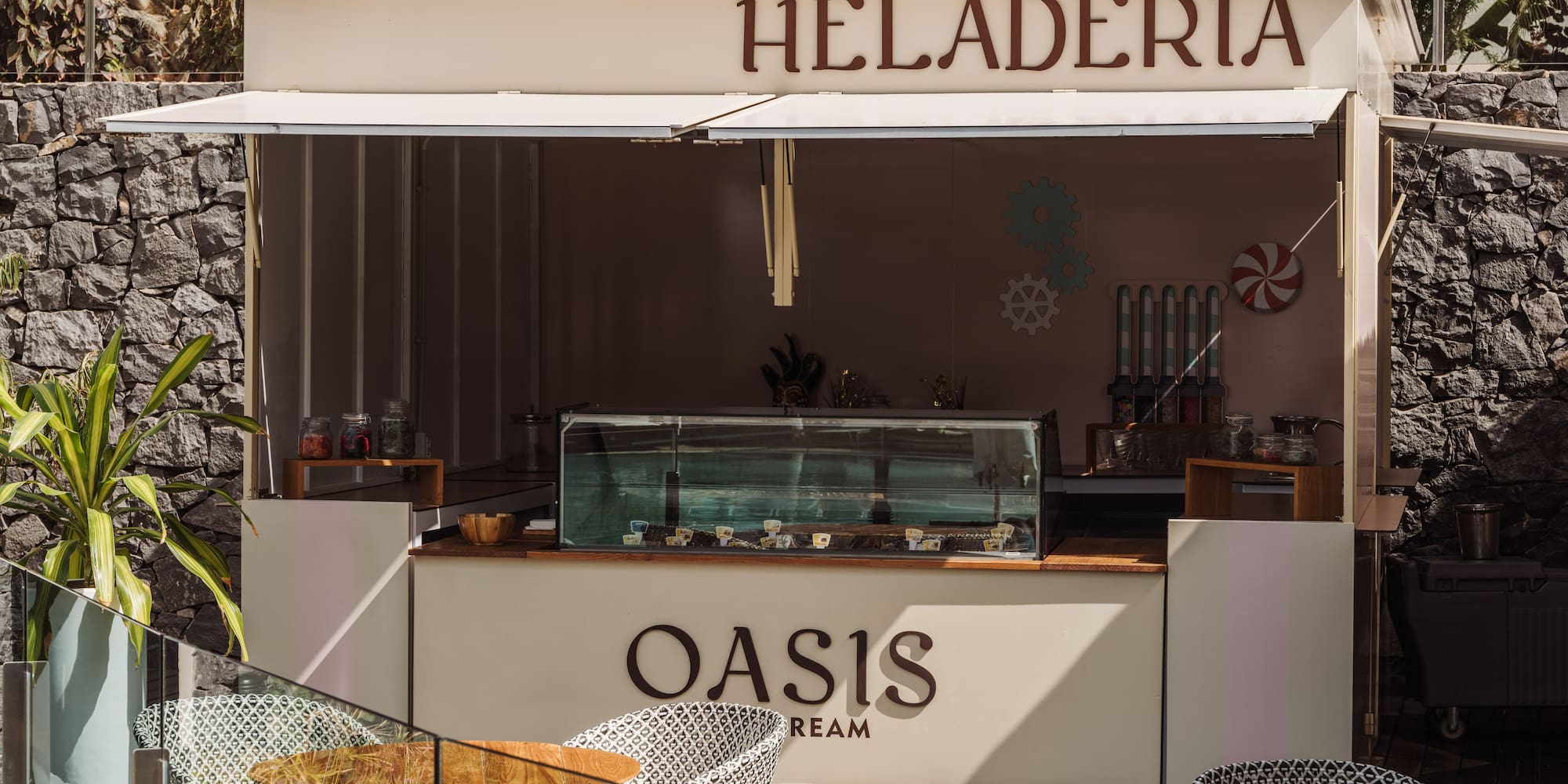 a food stand outside with tables and chairs