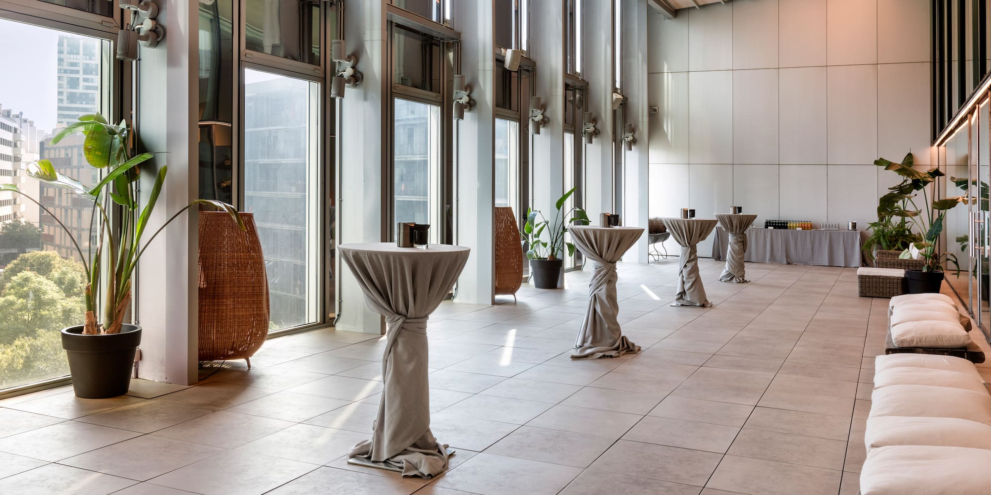 a room with tables covered in cloth