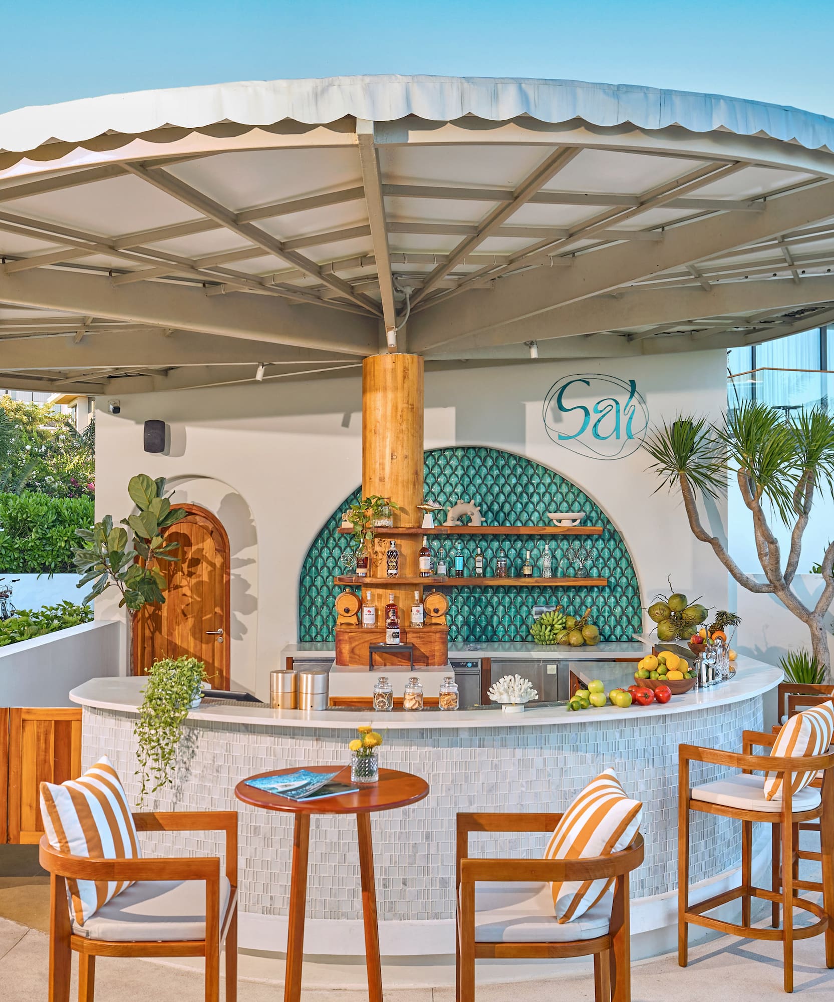 a bar with chairs and a table
