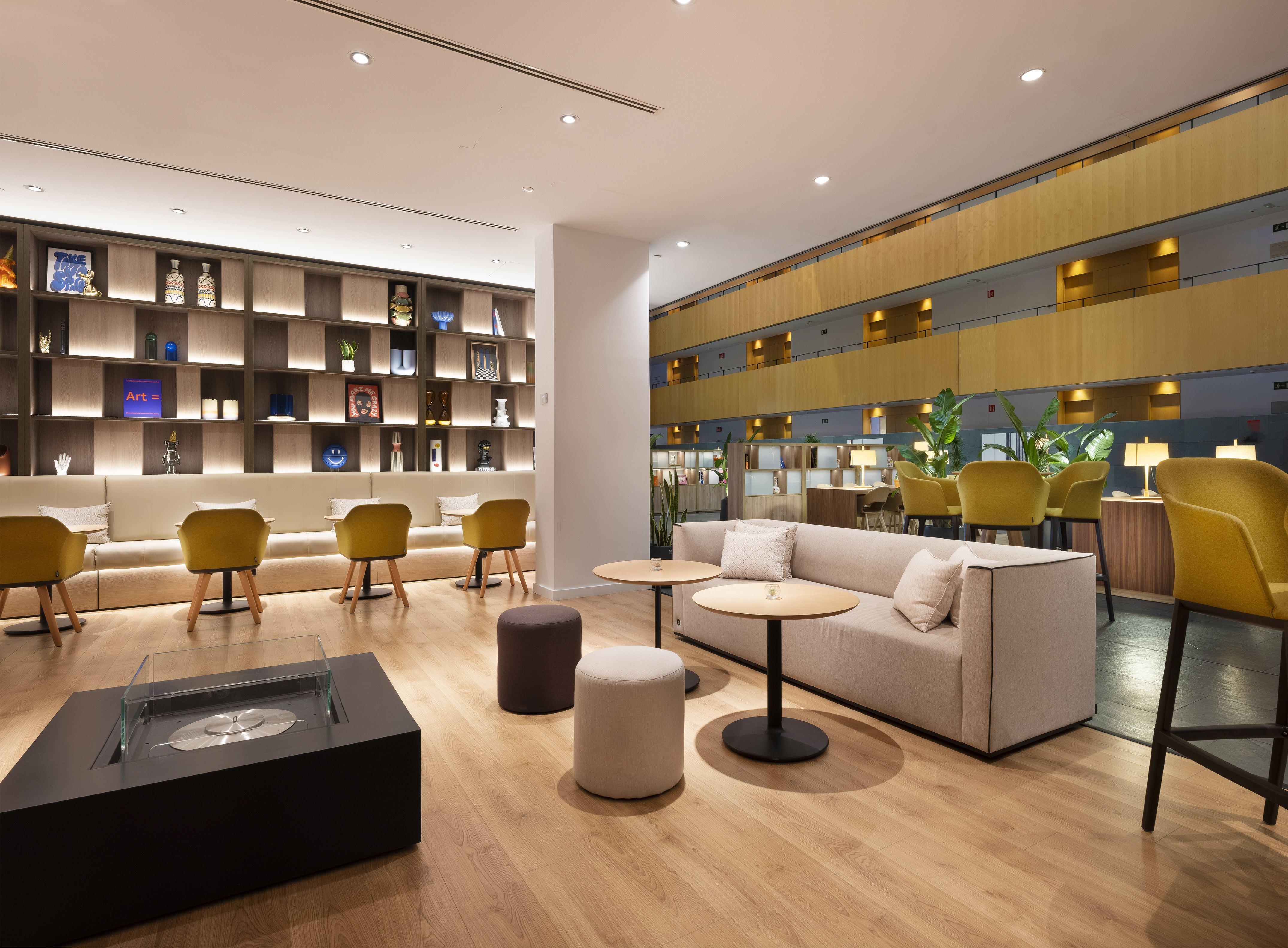 a room with a couch and tables and chairs