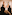 a group of people looking at a painting