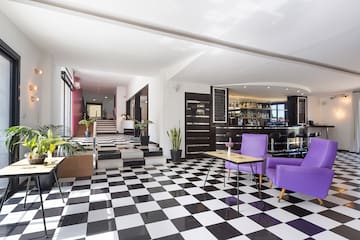 a room with purple chairs and a checkered floor
