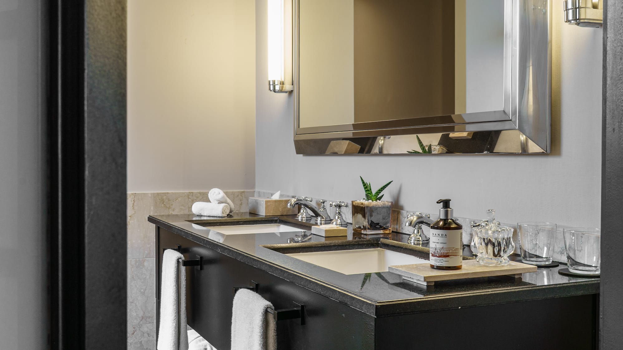 a bathroom with a mirror and a black vanity