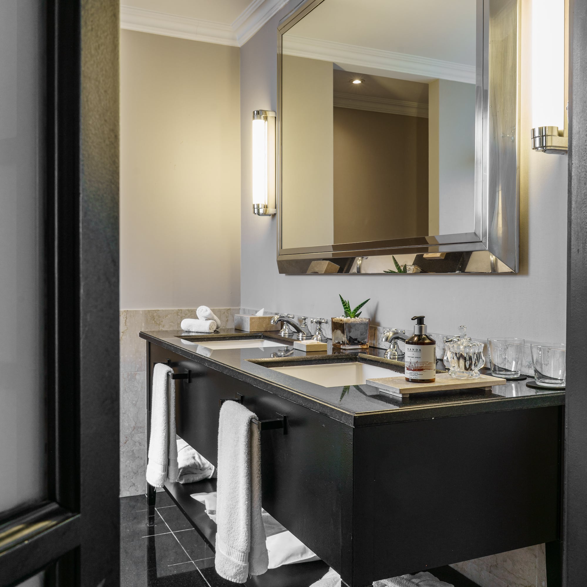 a bathroom with a mirror and a black vanity