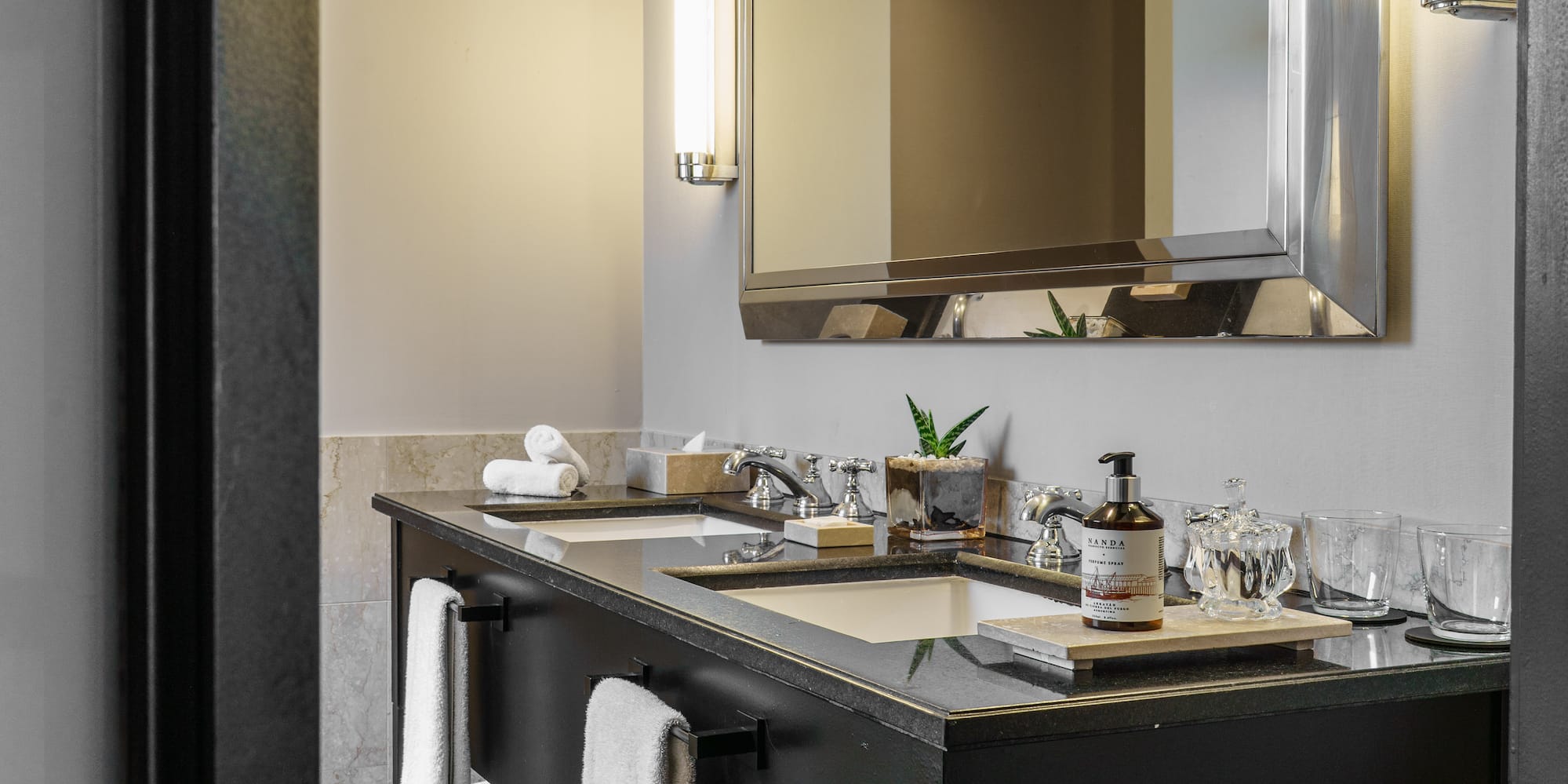 a bathroom with a mirror and a black vanity