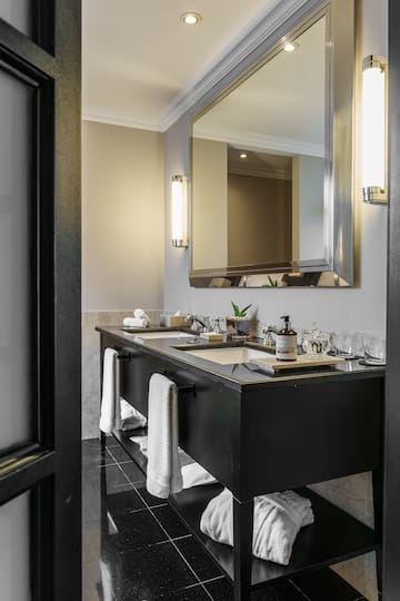 a bathroom with a mirror and a black vanity