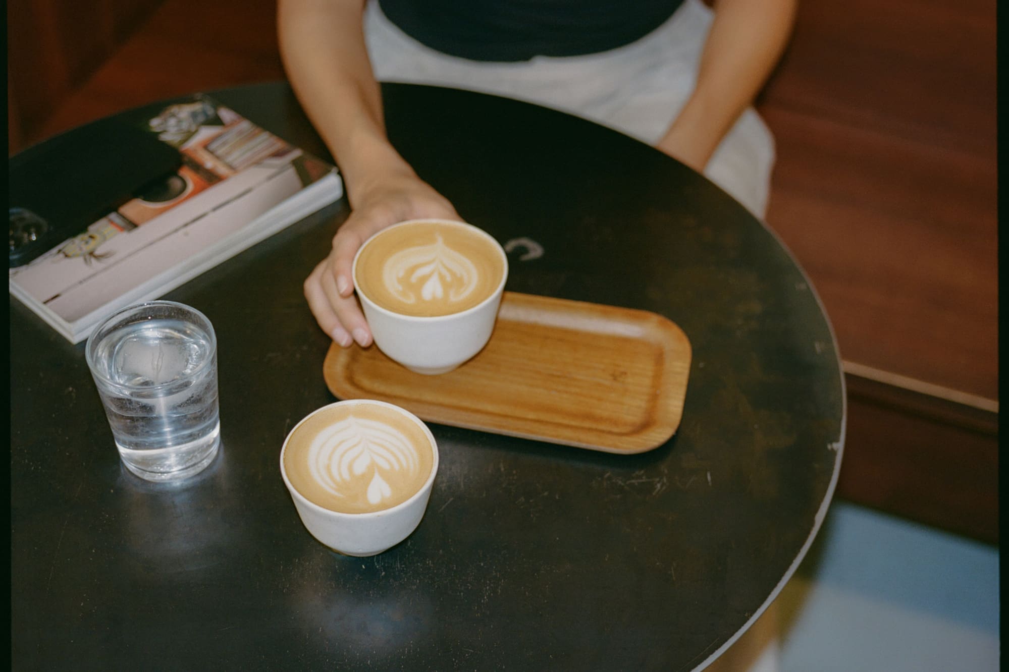 a woman holding a cup of coffee