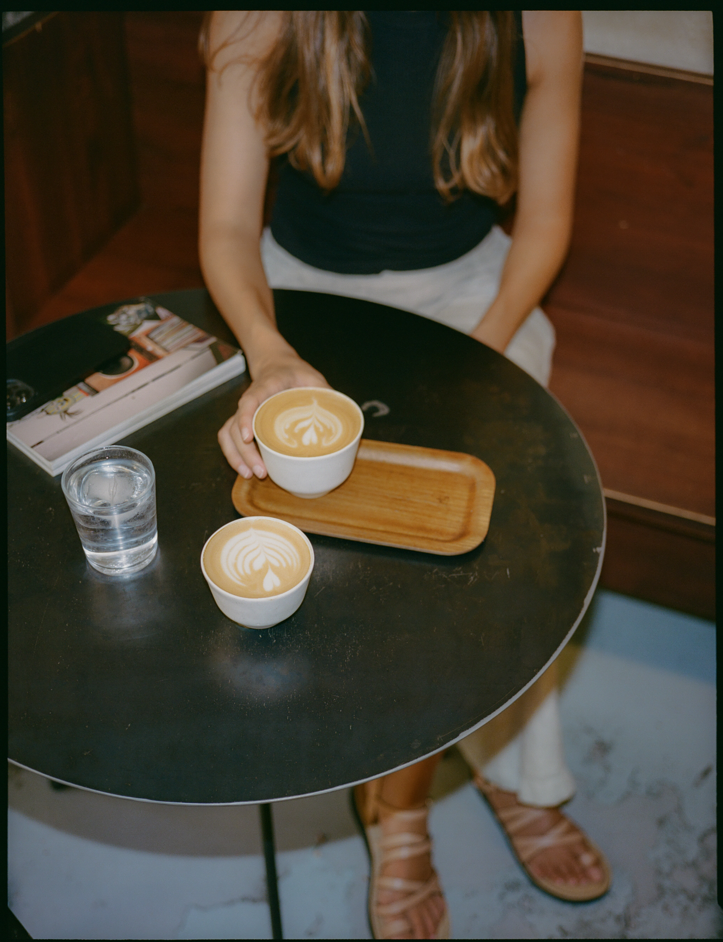 a woman holding a cup of coffee