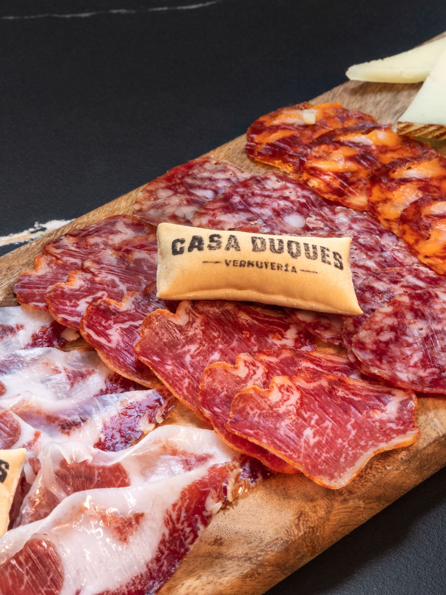 a cutting board with different types of meats