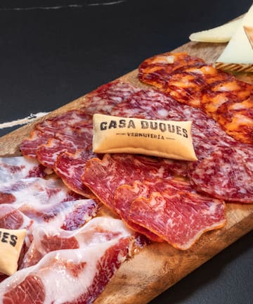 a cutting board with different types of meats
