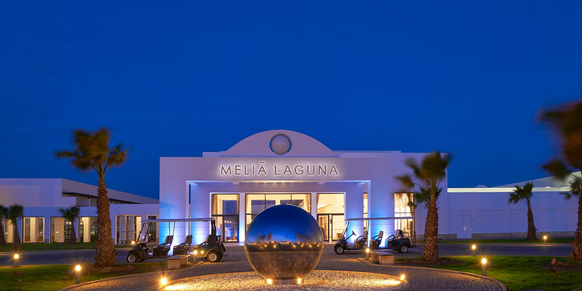 a building with a round ball in front of it