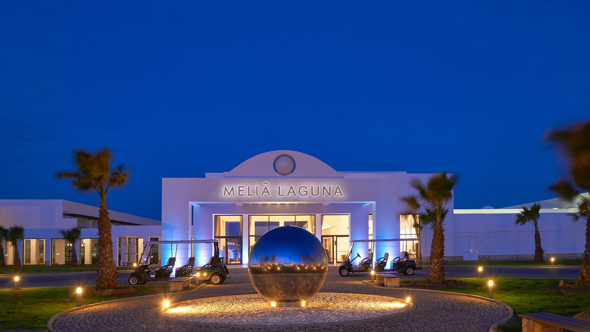 a building with a round ball in front of it