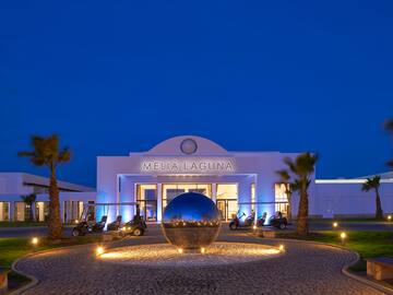 a building with a round ball in front of it