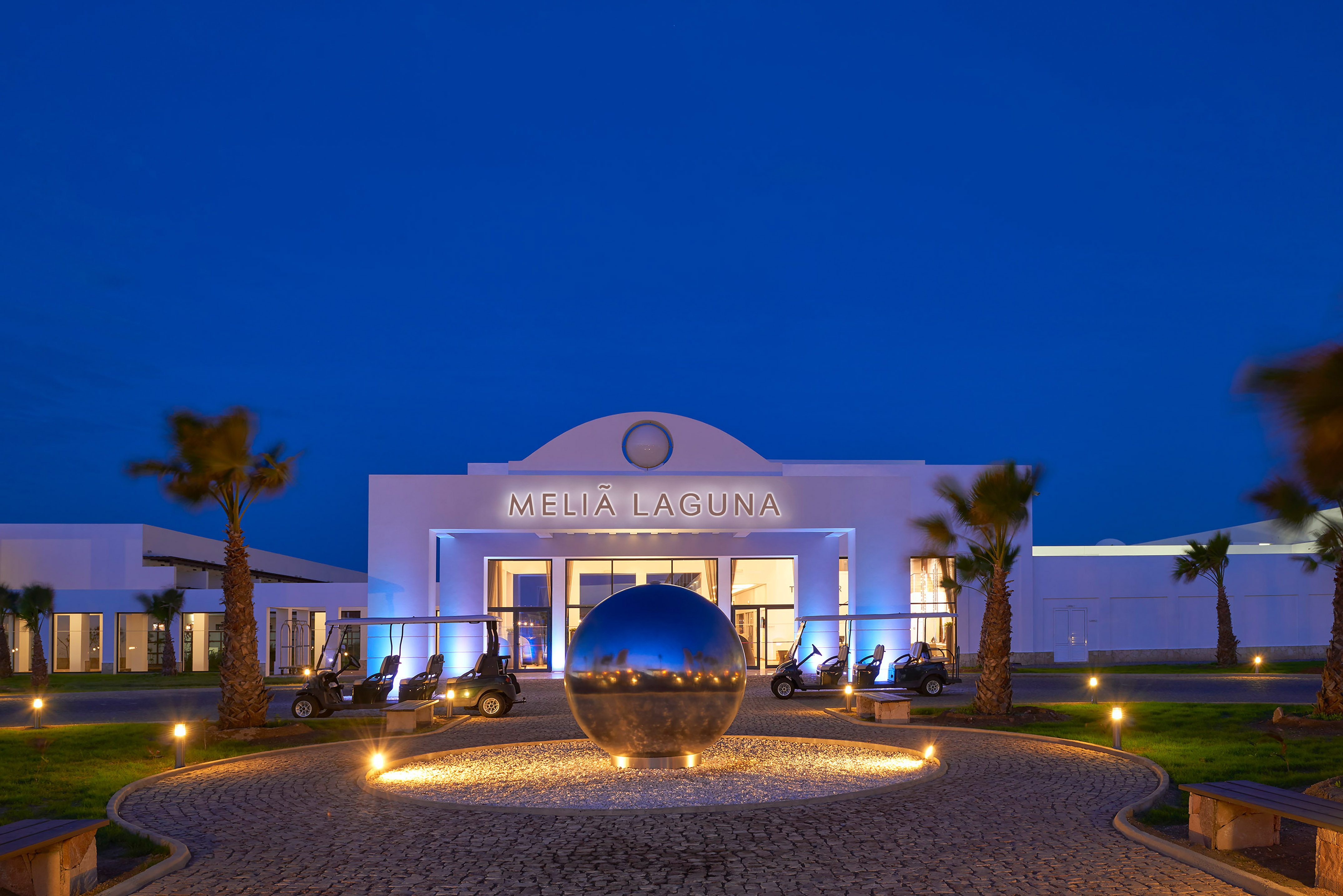 a building with a round ball in front of it