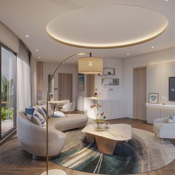 a living room with a round table and couches