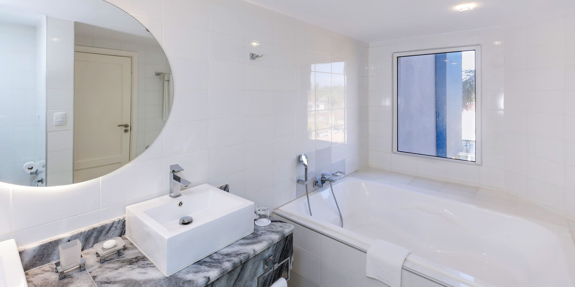 a bathroom with a sink and tub