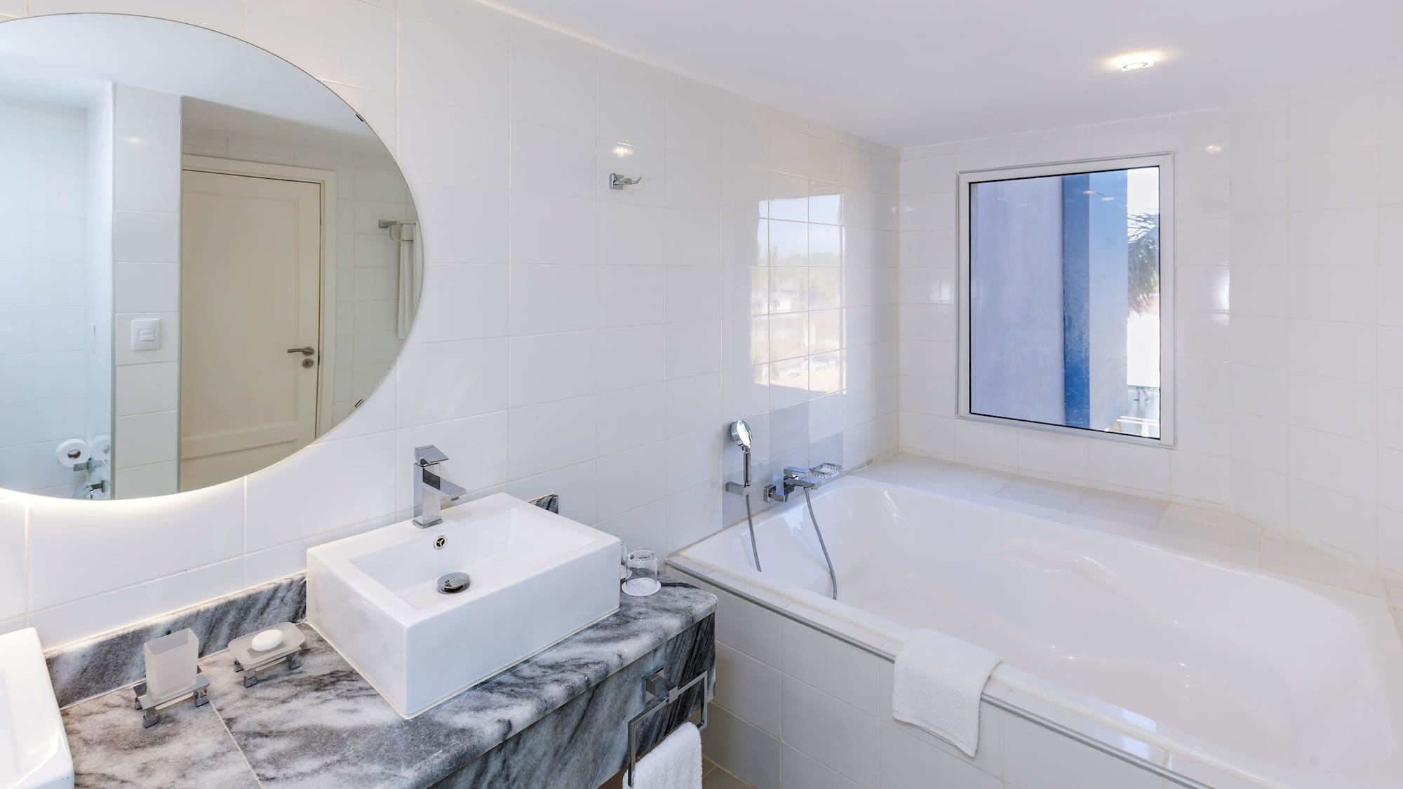 a bathroom with a sink and tub