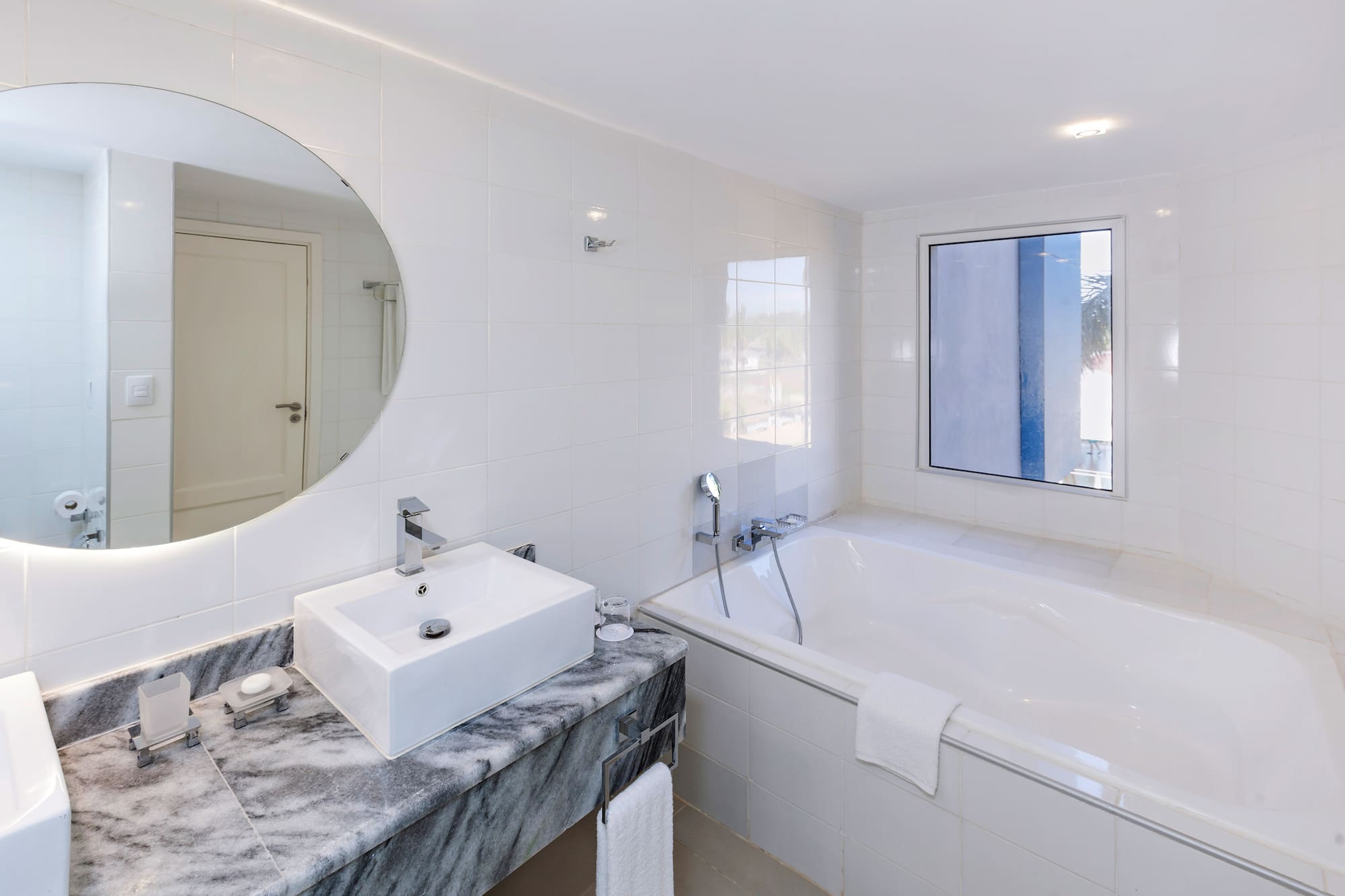 a bathroom with a sink and tub