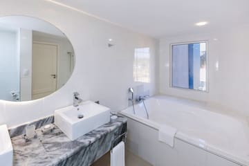 a bathroom with a sink and tub