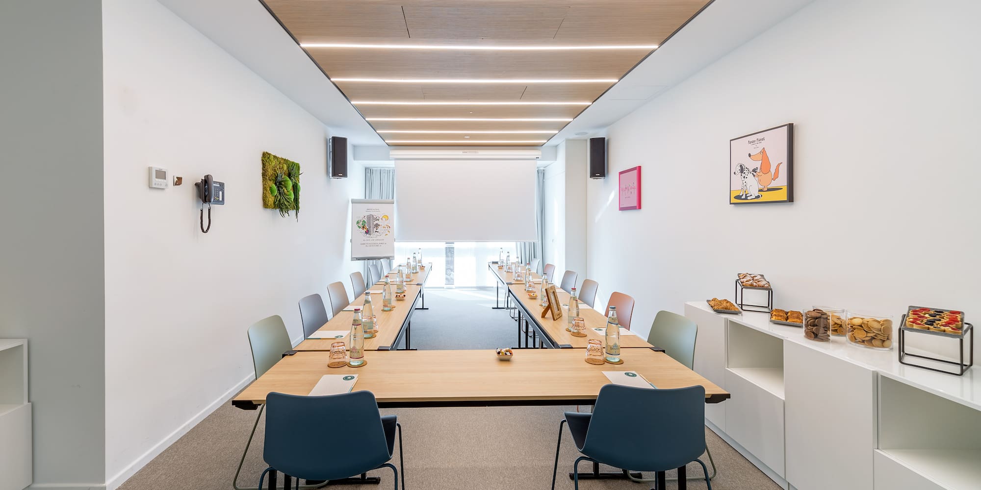 a room with long tables and chairs