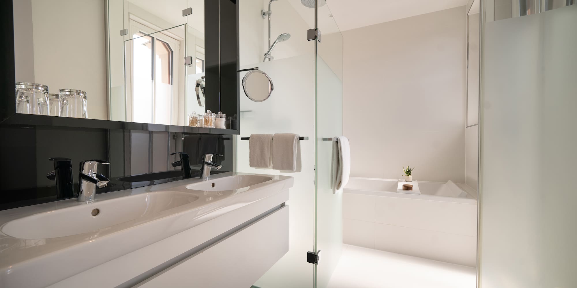 a bathroom with a glass shower door