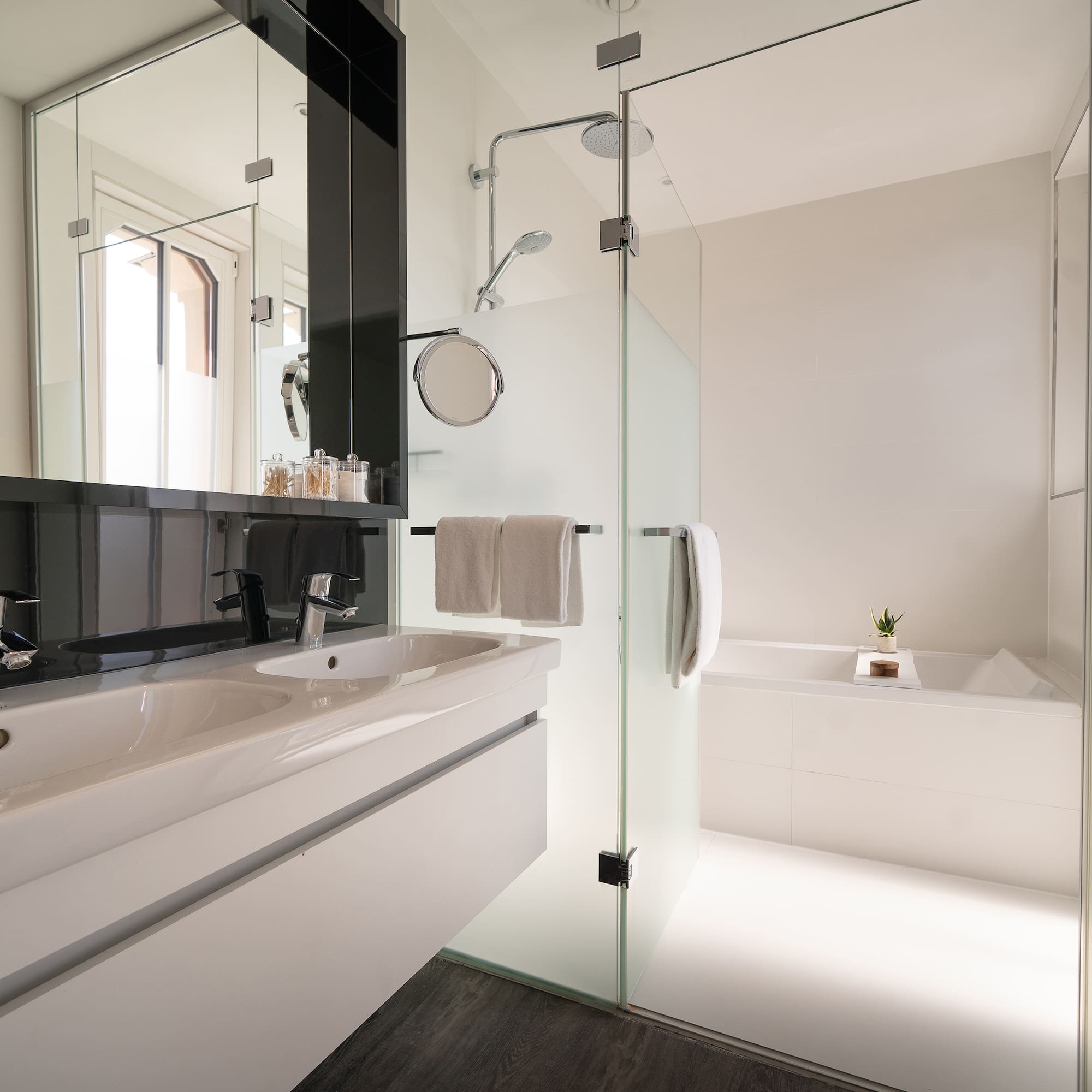 a bathroom with a glass shower door