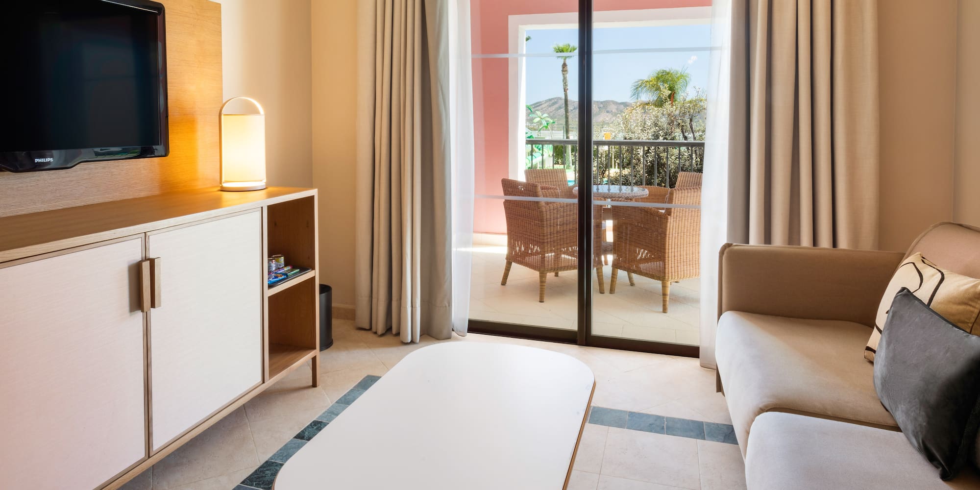 a living room with a television and a television set