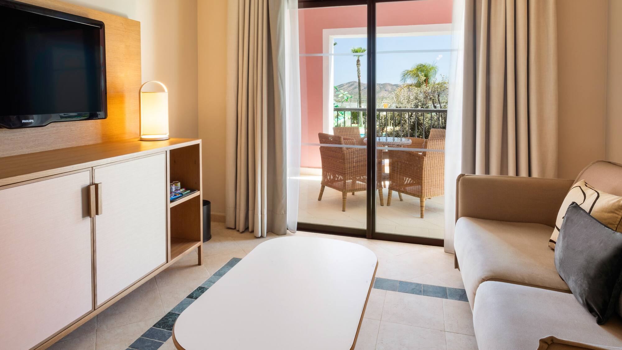 a living room with a television and a television set