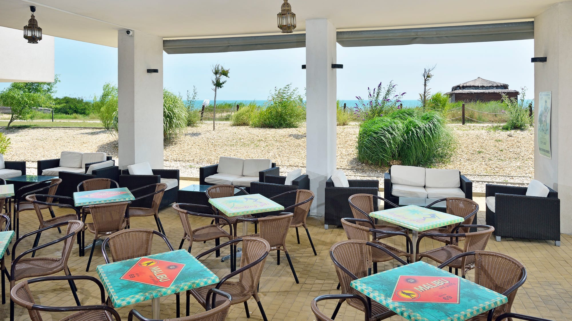 a patio with tables and chairs