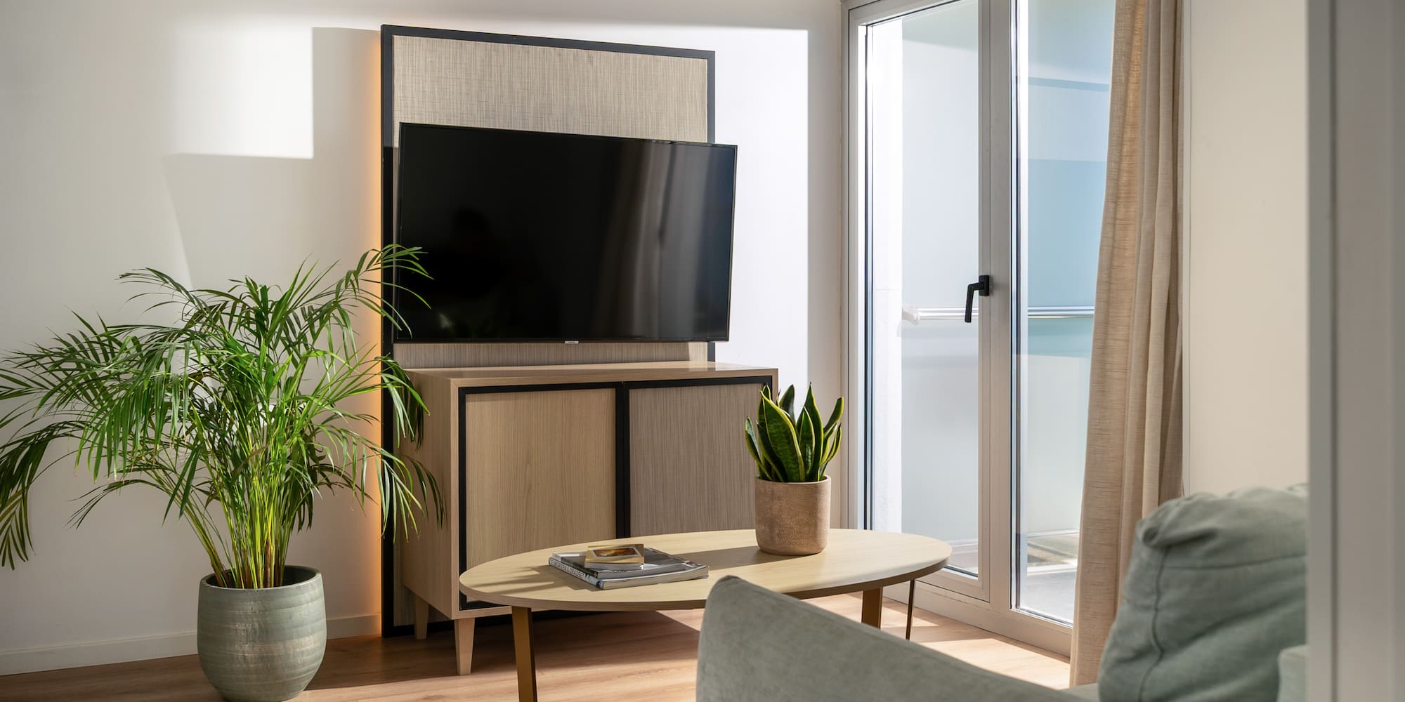 a living room with a television and a table