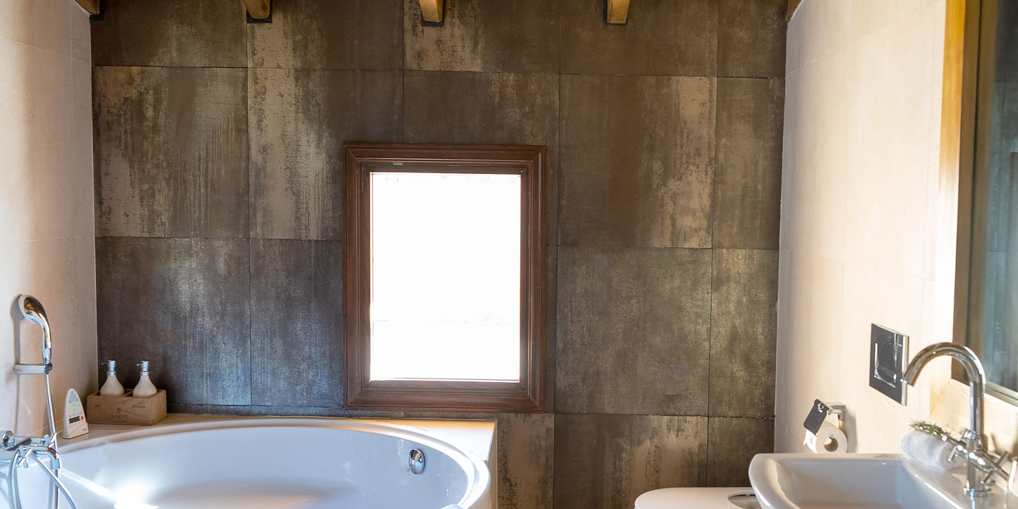 a bathroom with a tub and sink